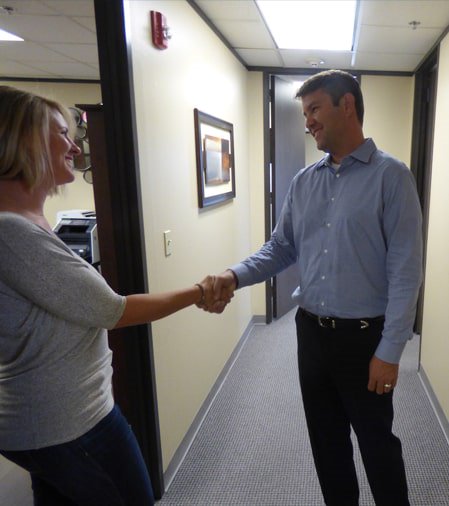 Photo of attorney David Christoffel meeting a client